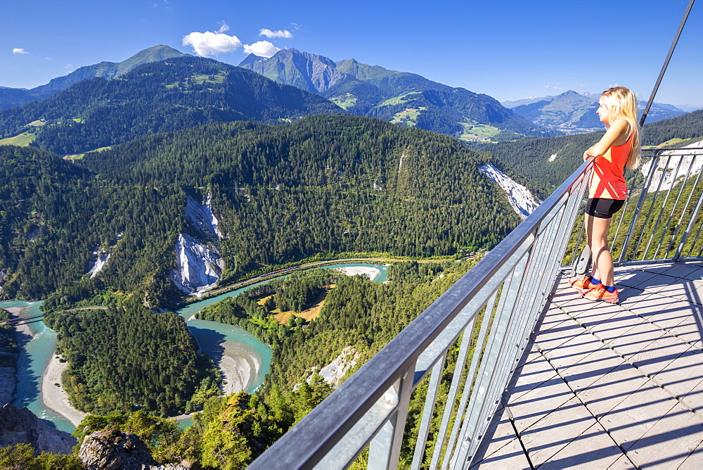 Young girl looks over the river from Il Spir terrace, Rhine Gorge (Ruinaulta), Flims, District of Imboden, Canton of Grisons (Graubunden), Switzerland, Europe