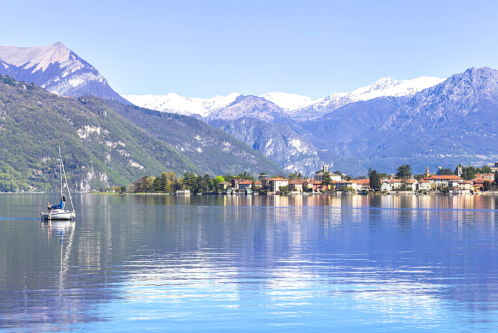 Sailboat on the lake in front Mandello del Lario, Province of Lecco, Lake Como, Italian Lakes, Lombardy, Italy, Europe