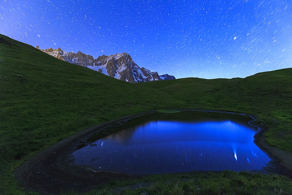 Stars reflected in a pool, Mont de la Saxe, Ferret Valley, Courmayeur, Aosta Valley, Italy, Europe