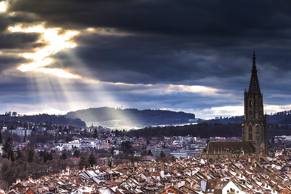 Sun ray between clouds above Bern Minster (Cathedral) (Berner Munster), Bern, Canton of Bern, Switzerland, Europe