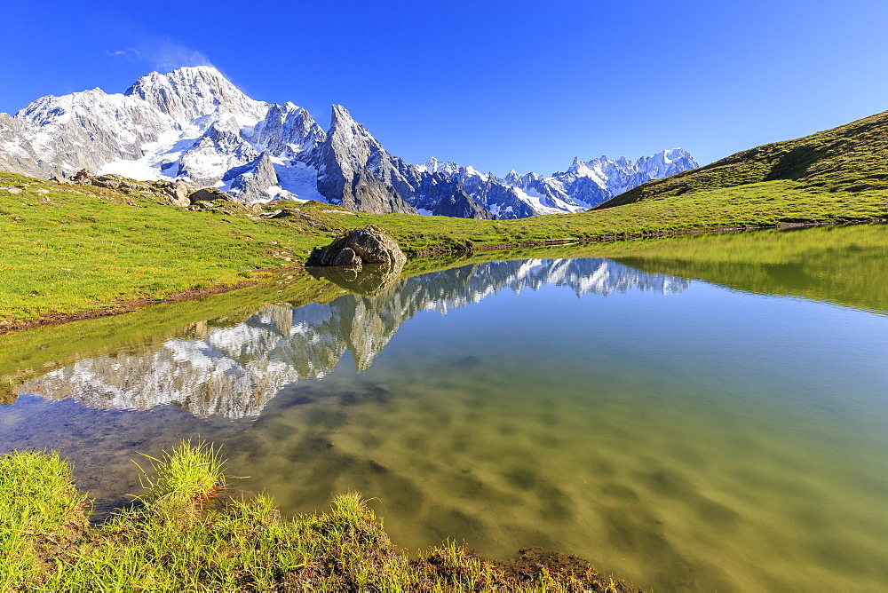 Mont Blanc group reflected in the Lac des Vesses (Vesses Lake), Veny Valley, Courmayeur, Aosta Valley, Italy, Europe