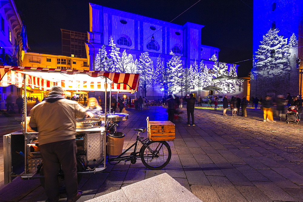 Chestnut seller in the square at night, Sondrio, Valtellina, Sondrio province, Lombardy, Italy, Europe