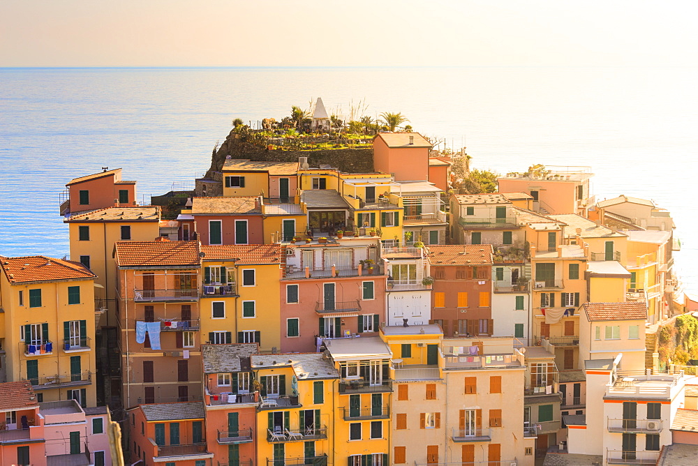 Sunlight behind the houses of Manarola, Cinque Terre, UNESCO World Heritage Site, Liguria, Italy, Europe