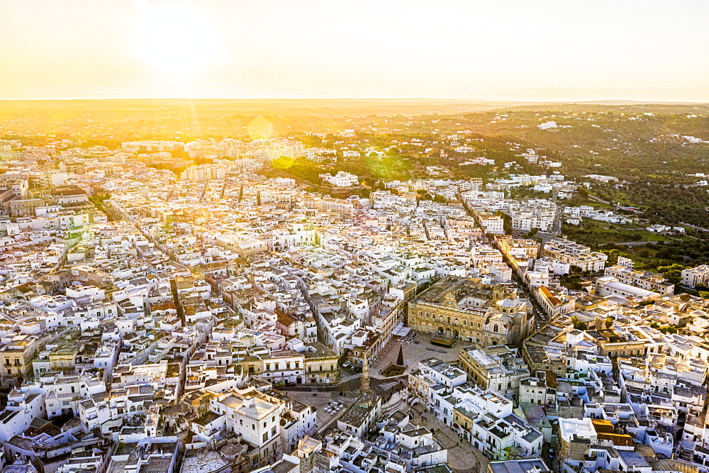 Aerial view by drone of Polignano a Mare at sunrise, Polignano a Mare, Apulia, Italy, Europe