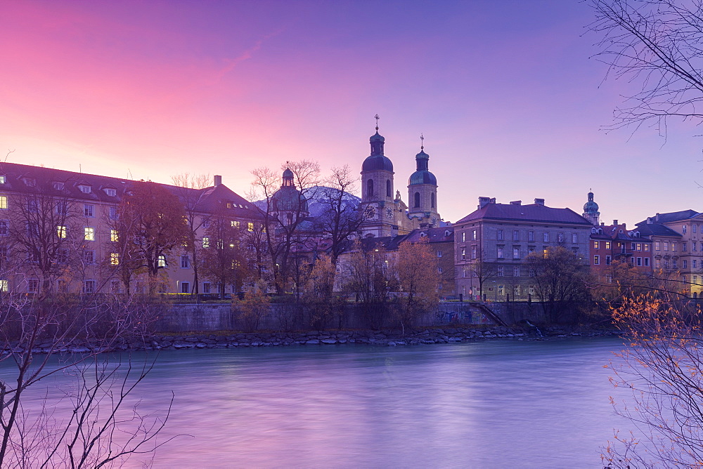 Cathedral of St. James is reflected in Inn River at sunrise, Innsbruck, Tyrol, Austria, Europe