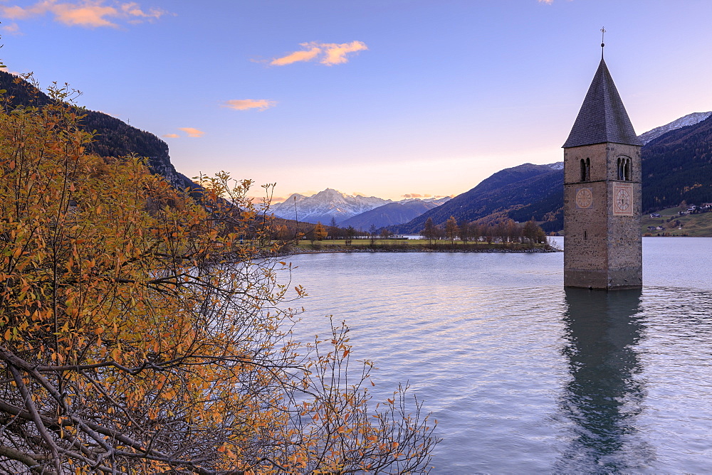 Sunset from the famous bell tower of Curon Venosta, Resia Pass, South Tyrol, Italy, Europe