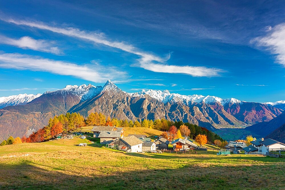 Amazing clouds above a traditional mountain village, Valchiavenna, Lombardy, Italy, Europe