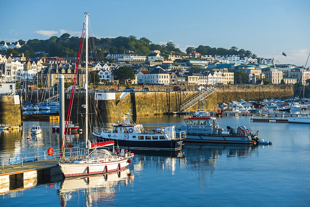 Boats in St. Peter Port Harbour at sunrise, Guernsey, Channel Islands, United Kingdom, Europe