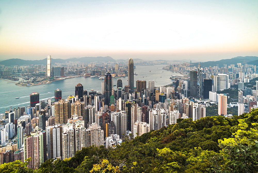 View over Victoria Harbour at sunset, seen from Victoria Peak, Hong Kong Island, Hong Kong, China, Asia