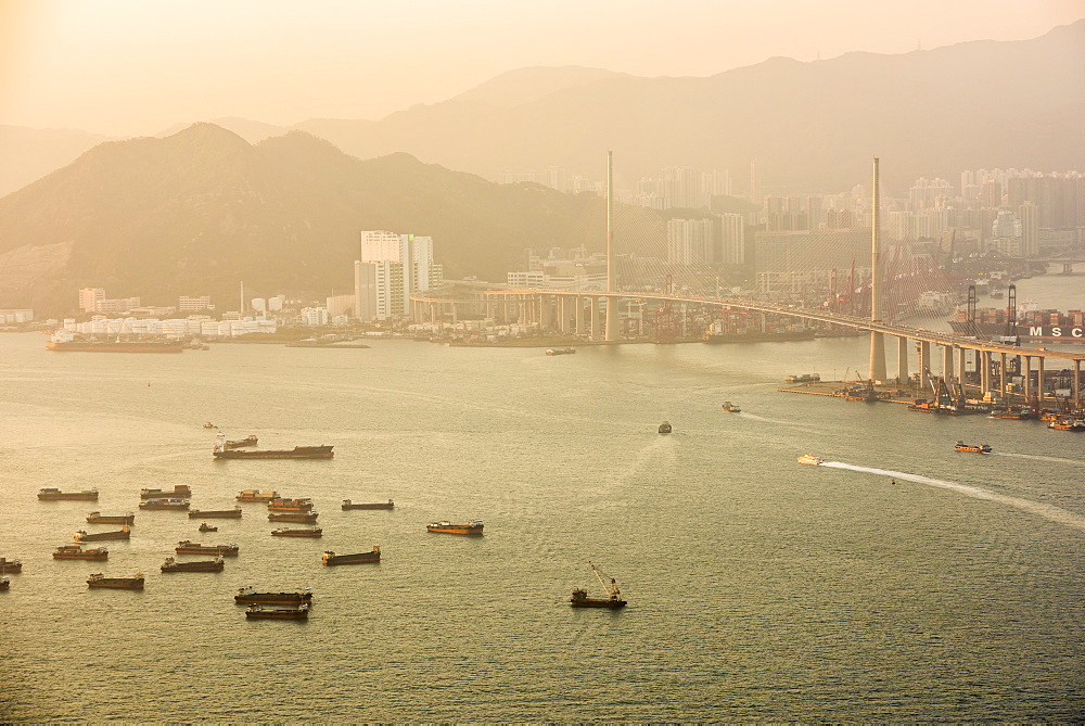 Boats in Victoria Harbour at sunset, seen from Victoria Peak, Hong Kong Island, Hong Kong, China, Asia