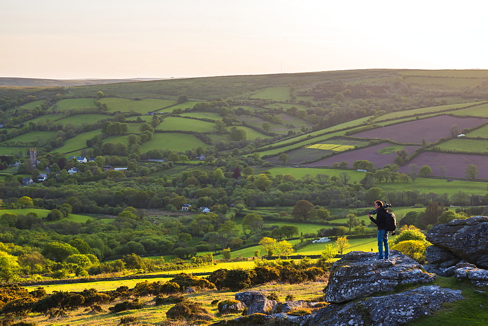 Photographer on a Tor in Dartmoor National Park, Devon, England, United Kingdom, Europe