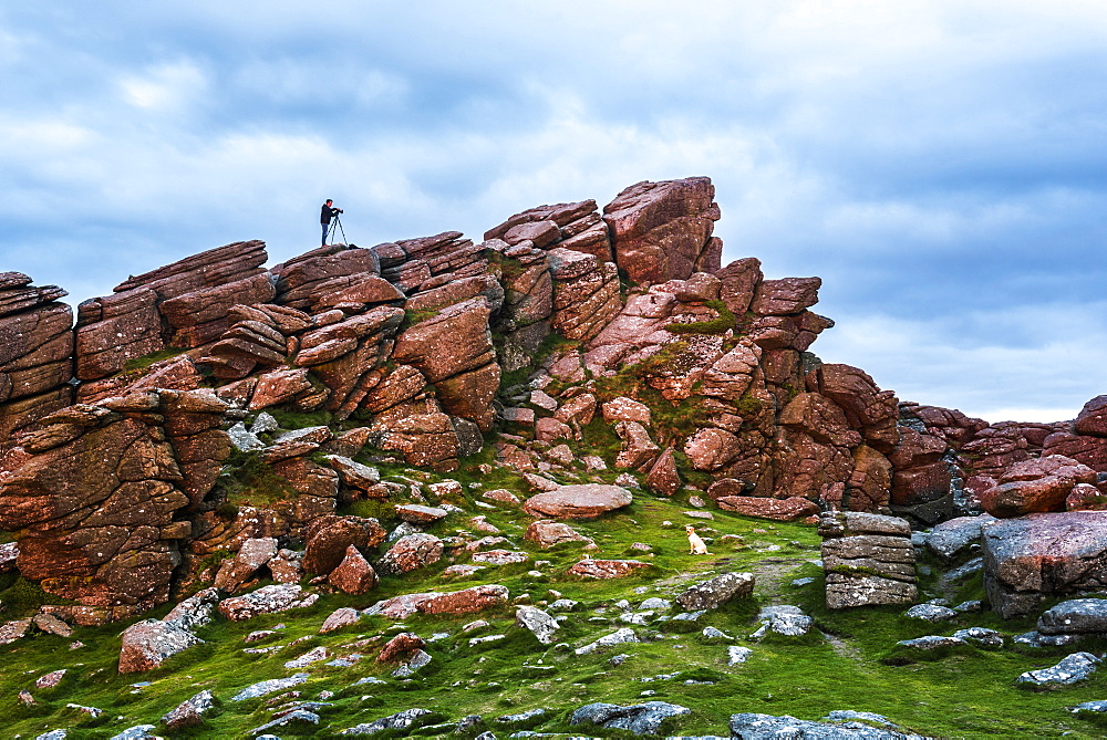 Photographer on a Tor in Dartmoor National Park, Devon, England, United Kingdom, Europe