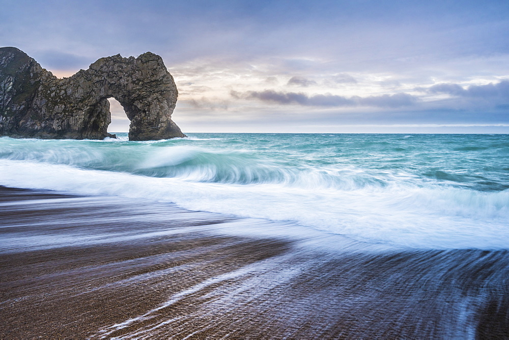 Durdle Door at sunrise, Lulworth Cove, Jurassic Coast, UNESCO World Heritage Site, Dorset, England, United Kingdom, Europe