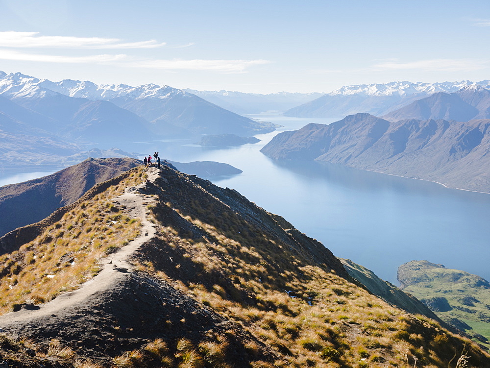 Hikers enjoying the view from the Roys Peak hiking trail near Wanaka, Otago, South Island, New Zealand, Pacific