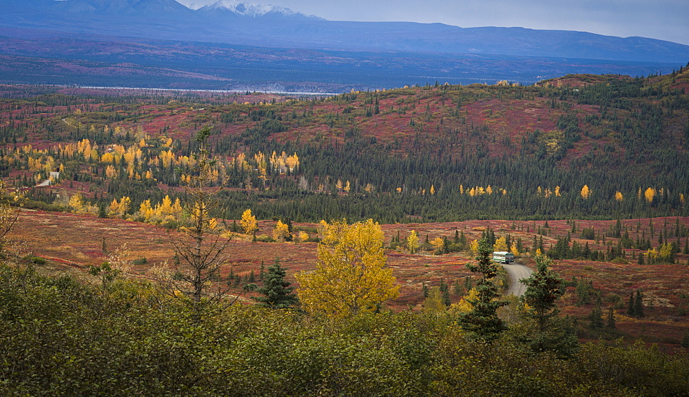 Camper bus driving into the wonder lake campground deep in the Denali National Park, Alaska, United States of America, North America