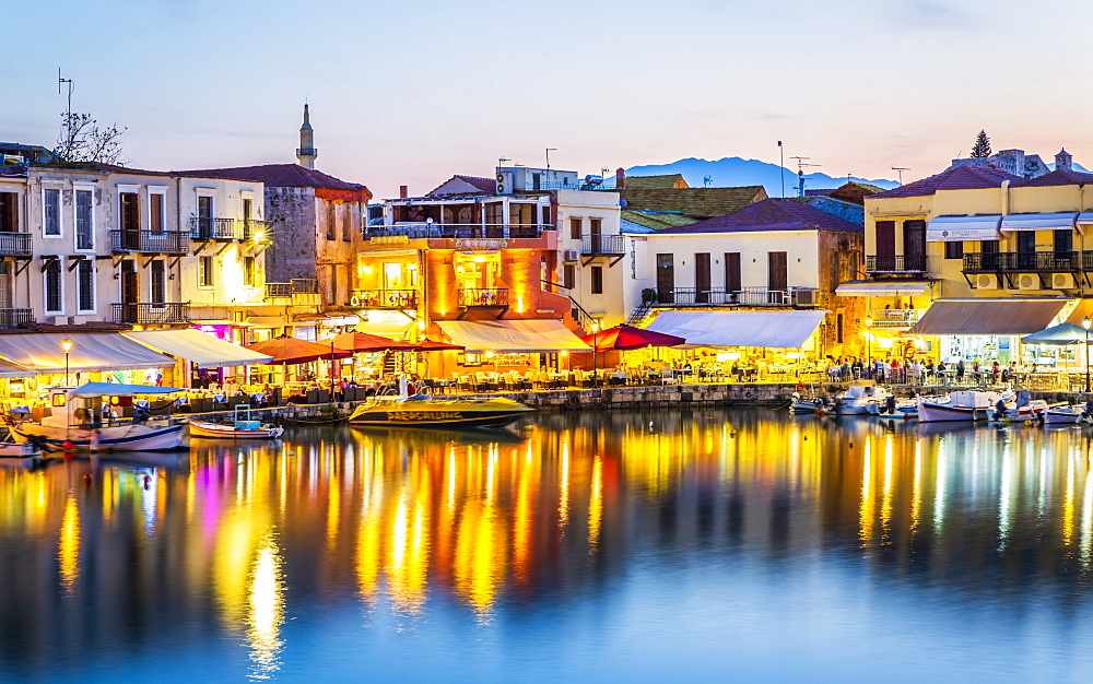 Old Venetian harbour, taverns on seaside at dusk, Rethymno (Rethymnon), Crete, Greek Islands, Greece, Europe