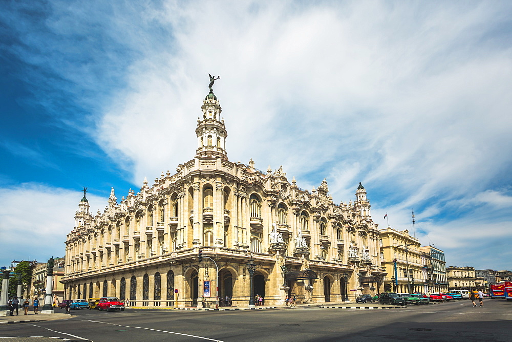 Old American cars drive past the Gran Teatro de La Habana in La Habana (Havana), Cuba, West Indies, Caribbean, Central America