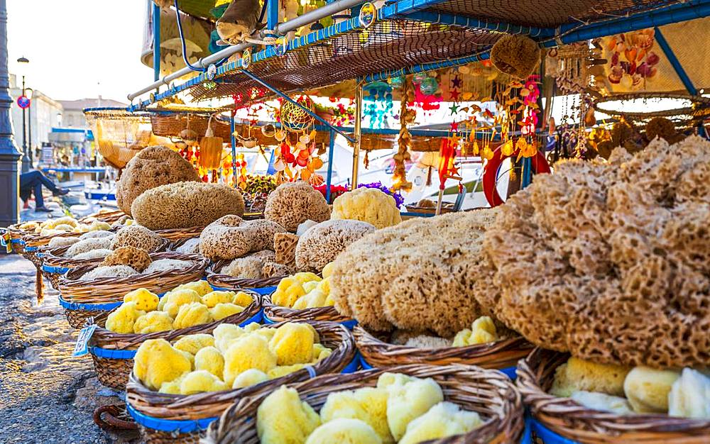 Souvenirs and sea sponges for sale on a boat in Chania, Crete, Greek Islands, Greece, Europe