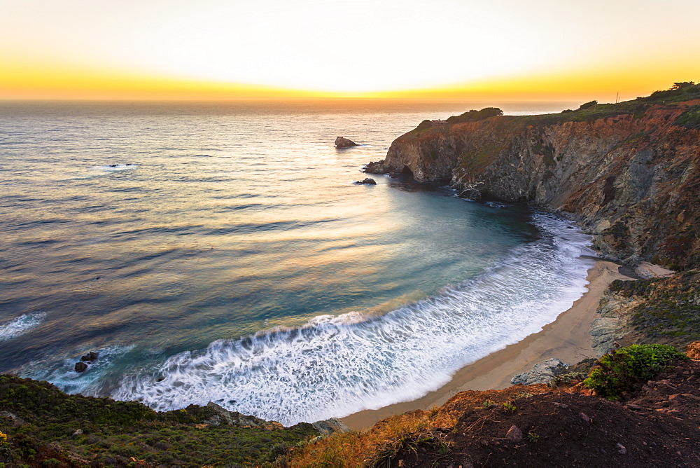 Sunset over The Pacific Ocean at Andrew Molera State Park south of Monterey, Big Sur, California, United States of America, North America