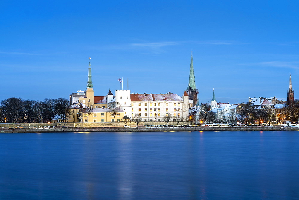 Riga's skyline and President Castle at night in winter, Old Town, UNESCO World Heritage Site, Riga, Latvia, Europe