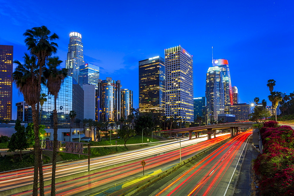 Downtown financial district of Los Angeles city and busy freeway at night, Los Angeles, California, United States of America, North America