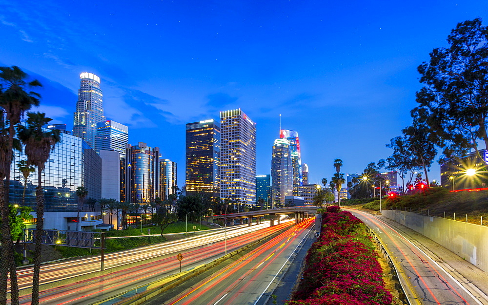 Downtown financial district of Los Angeles city and busy freeway at night, Los Angeles, California, United States of America, North America