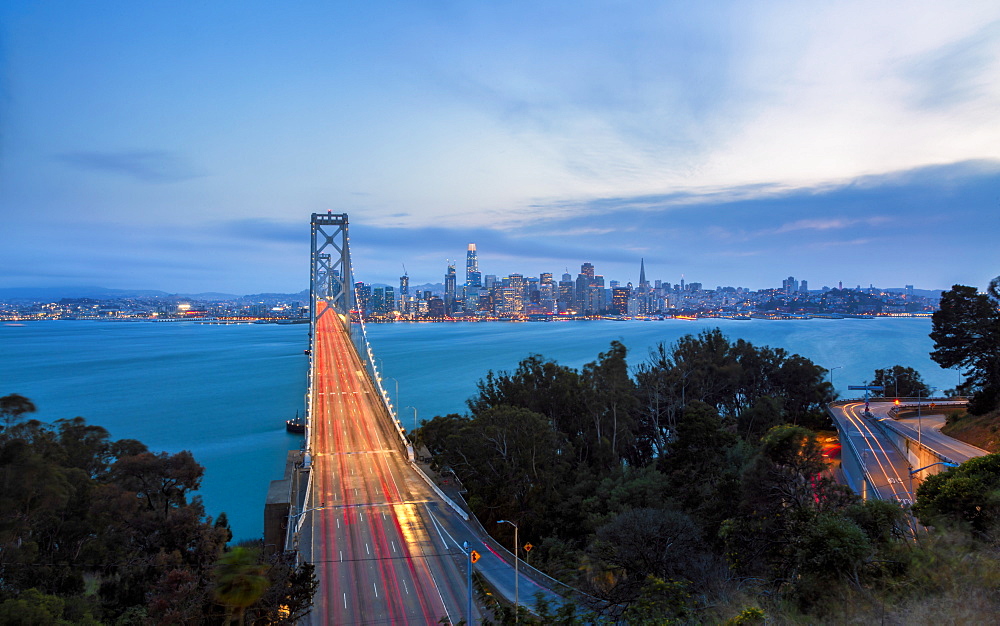 View of San Francisco skyline and Oakland Bay Bridge from Treasure Island at dusk, San Francisco, California, United States of America, North America