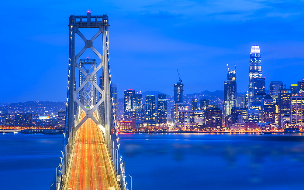 View of San Francisco skyline and Oakland Bay Bridge from Treasure Island at dusk, San Francisco, California, United States of America, North America