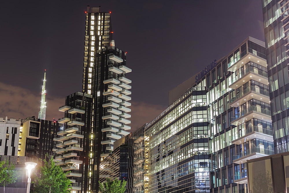 Skyline at night, iIlluminated view of modern Milano skyscrapers seen from Piazza Lina Bo Bardi, Milan, Lombardy, Italy, Europe