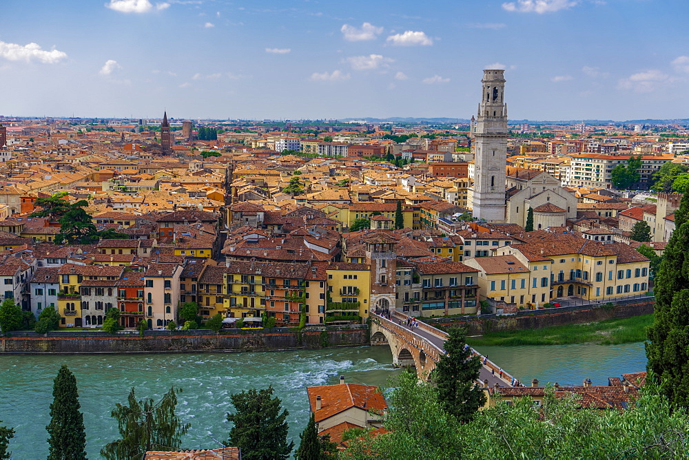 Panorama of traditional buildings with the Ponte Pietra stone Roman arch bridge crossing the River Adige, Verona, Veneto, Italy, Europe