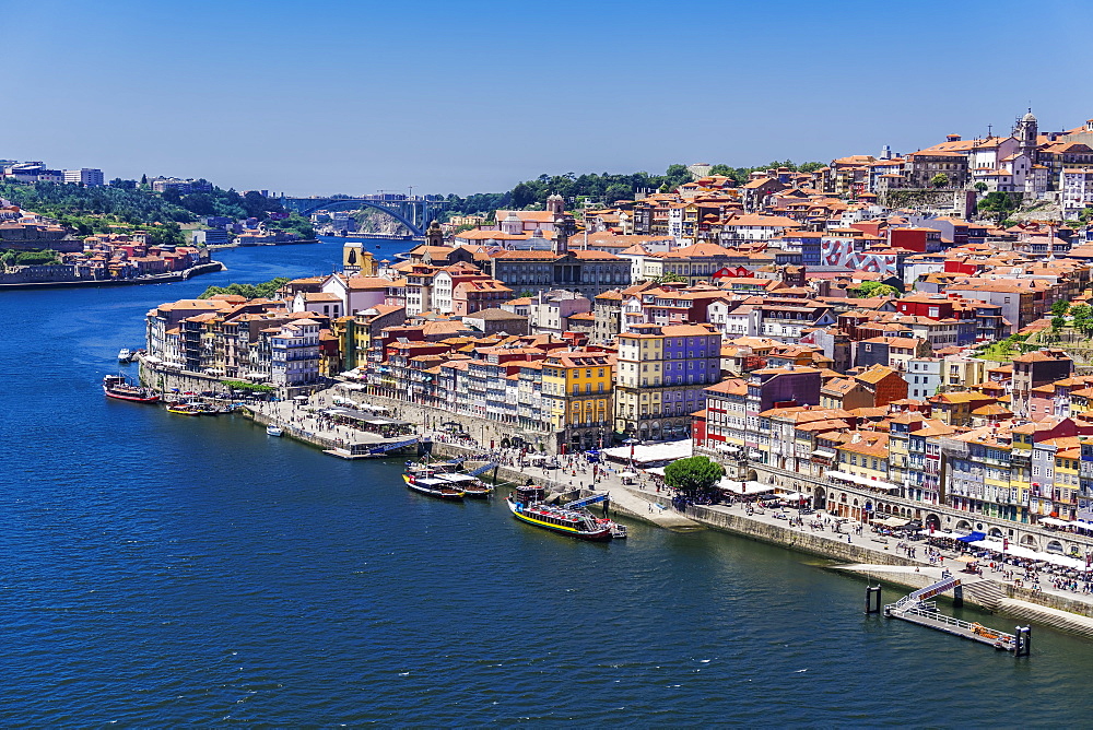 The Douro River banks with waterfront houses and boats seen from Dom Luis I Bridge, Porto, Portugal, Europe