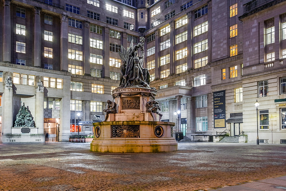 Illuminated night view of Admiral Horatio Nelson 1813 bronze monument at an empty square north of the Town Hall, Liverpool, Merseyside, England, United Kingdom, Europe