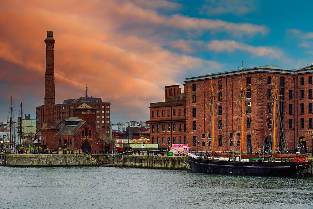 Evening view of Royal Albert Dock brick and stone buildings and warehouses, including The Pumphouse, Liverpool, Merseyside, England, United Kingdom, Europe