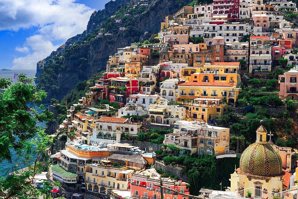 Positano town hill view with low rise colorful buildings above the sea line, Positano, Amalfi Coast, UNESCO World Heritage Site, Campania, Italy, Europe