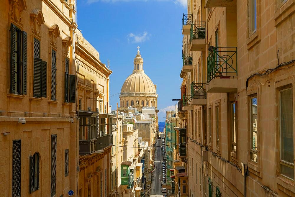 Valletta, Malta the Basilica of Our Lady of Mount Carmel Bazilika Santwarju tal-Madonna tal-Karmnu cupola, along Maltese houses.