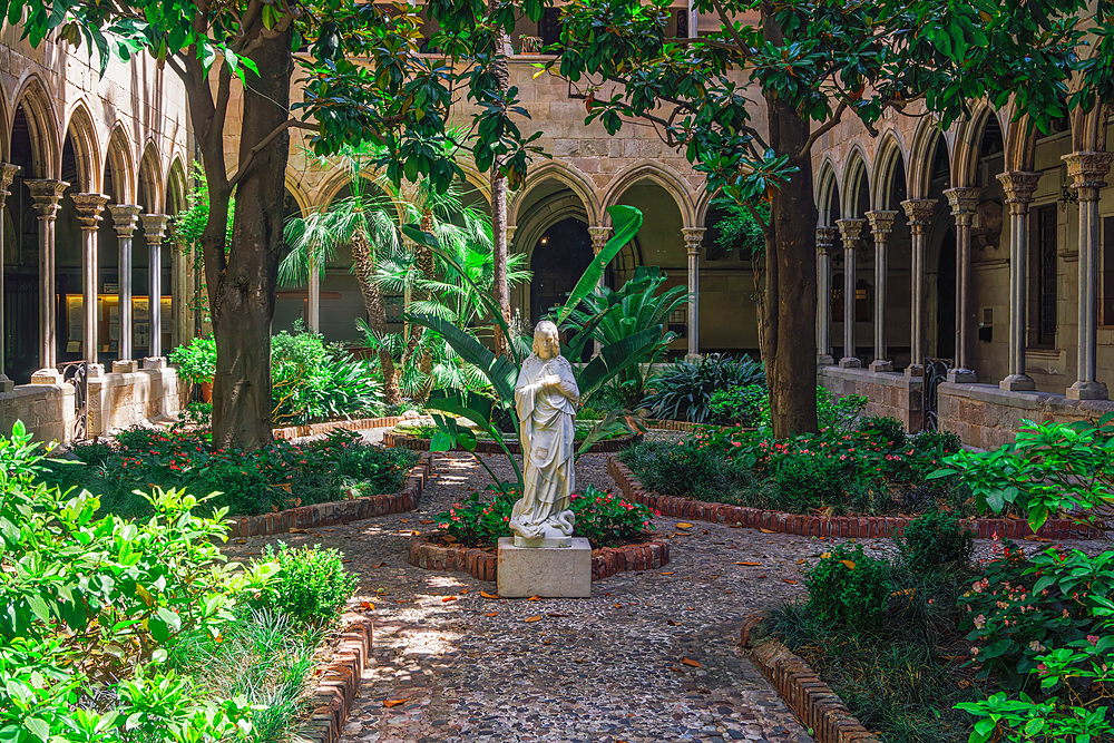 Jesus statue in the middle of a garden in Christian Church Basilica of the Immaculate Conception and Assumption of Our Lady (Basilica de la Purissima Concepcio), Barcelona, Catalonia, Spain, Europe