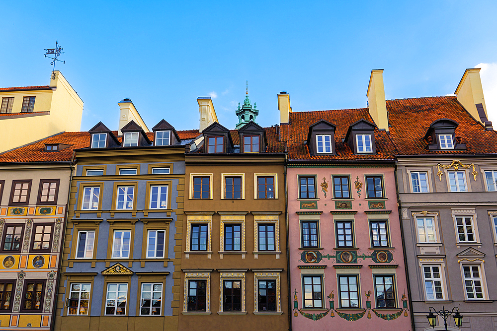 Low angle view of traditional low-rise roof-tiled Burghers houses with facade decorations in the Old Town Market Square (Rynek Starego Miastra), UNESCO World Heritage Site, Warsaw, Poland, Europe