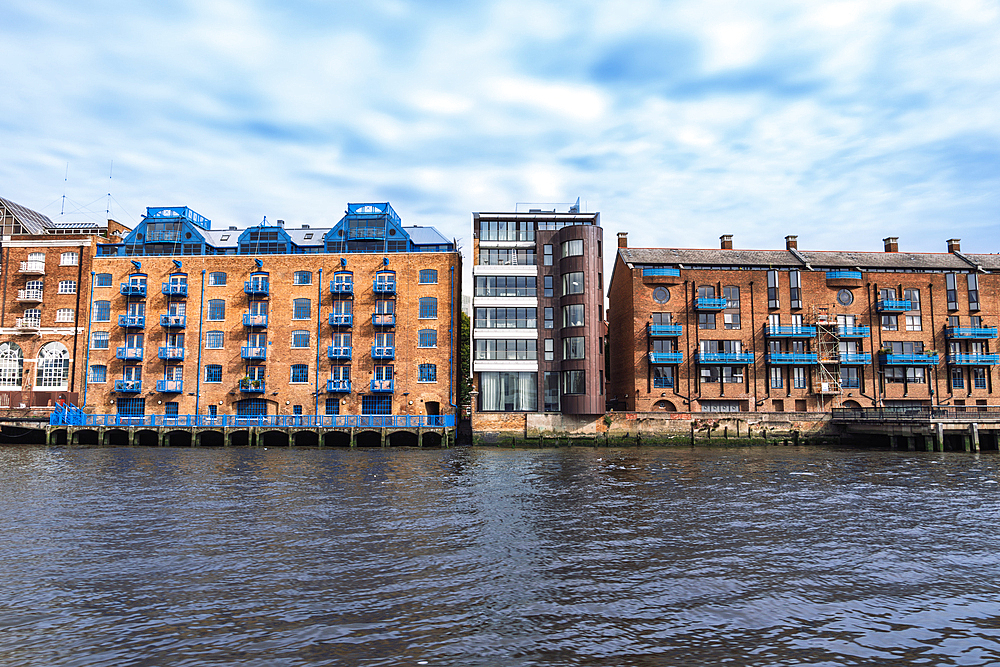 London, UK waterfront historic and modern buildings by the river Thames.