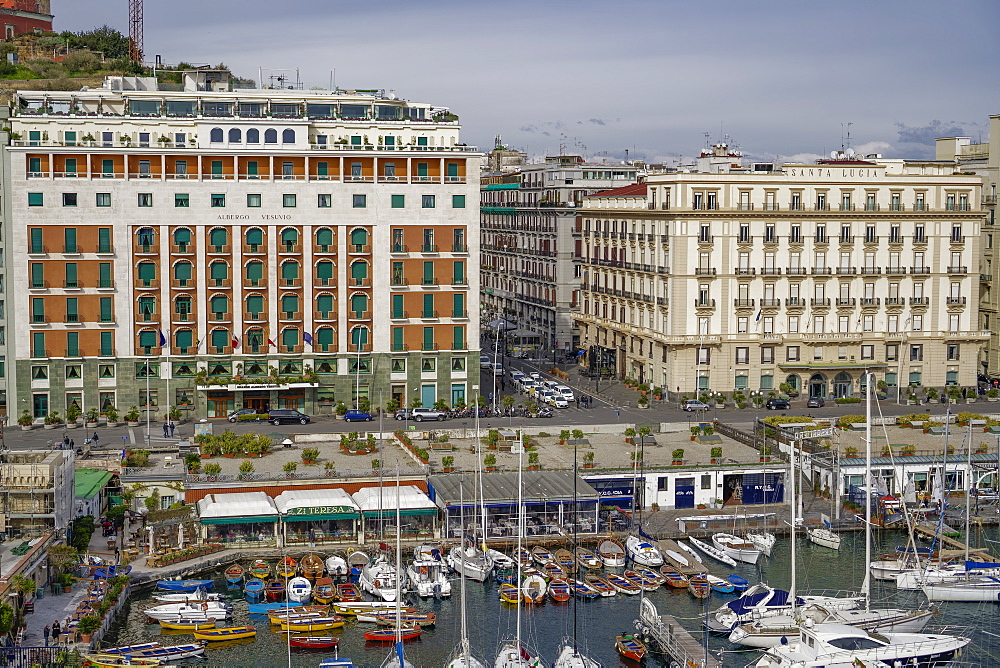 Promenade view from Ovo Castle of waterfront with hotels, and marina landscape seen from Castel dell Ovo islet fortress, Naples, Campania, Italy, Europe