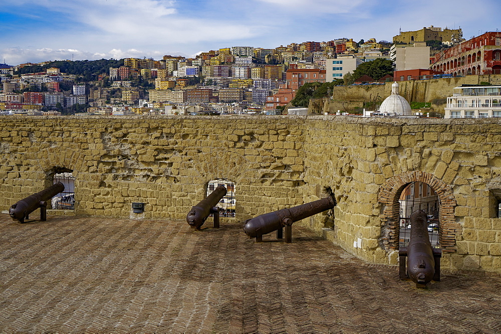 Ovo Castle fortifications with canons at Castel dell Ovo islet fortress and city view at the Gulf of Napoli, Naples, Campania, Italy, Europe