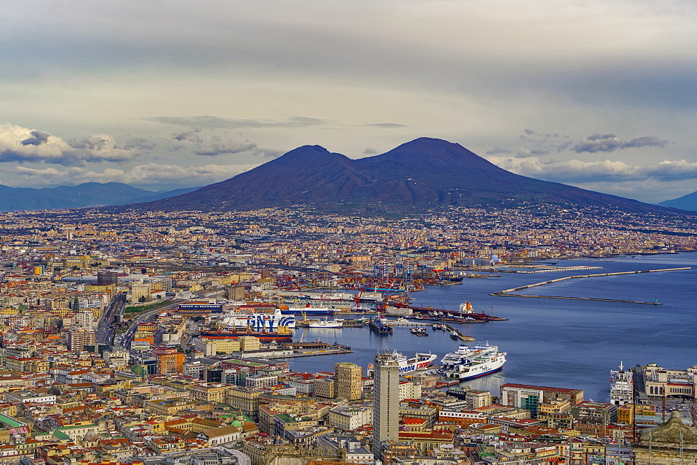 Panoramic city view over Seaport of Napoli with ships and Mount Vesuvius volcano, seen from Sant Elmo castle, Naples, Campania, Italy, Europe