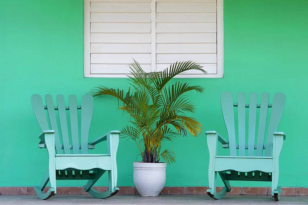 Green chairs on veranda, UNESCO World Heritage Site, Vinales, Pinar del Rio, Cuba, West Indies, Caribbean, Central America