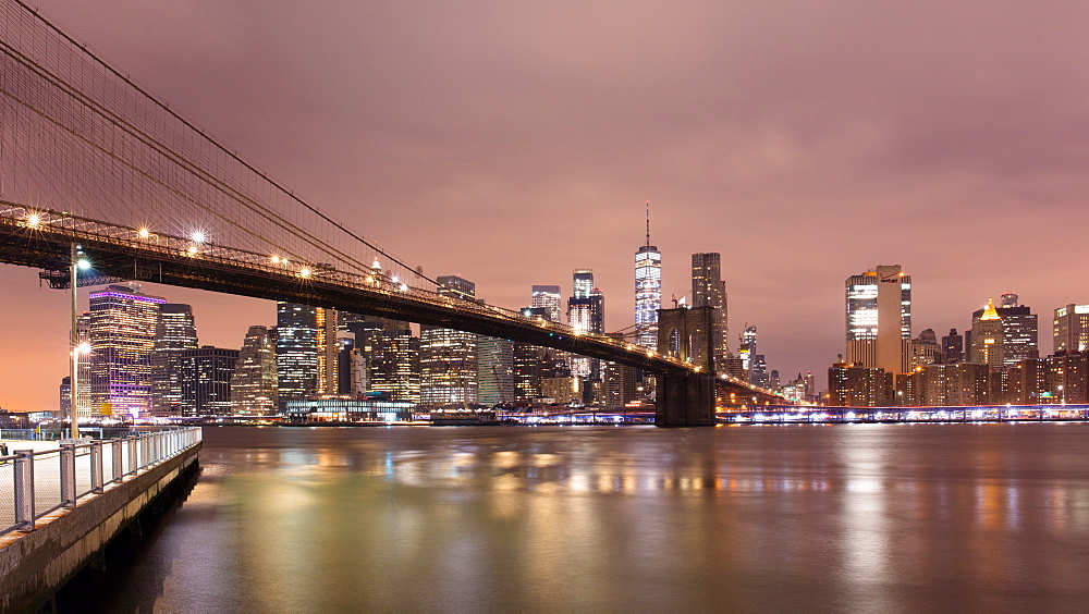 Brooklyn Bridge and Lower Manhattan skyline at dawn, New York City, New York, United States of America, North America