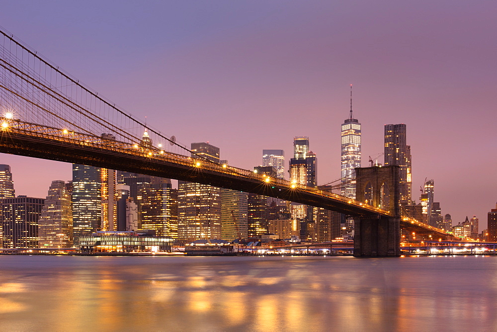 Brooklyn Bridge and Lower Manhattan skyline at dawn, New York City, New York, United States of America, North America