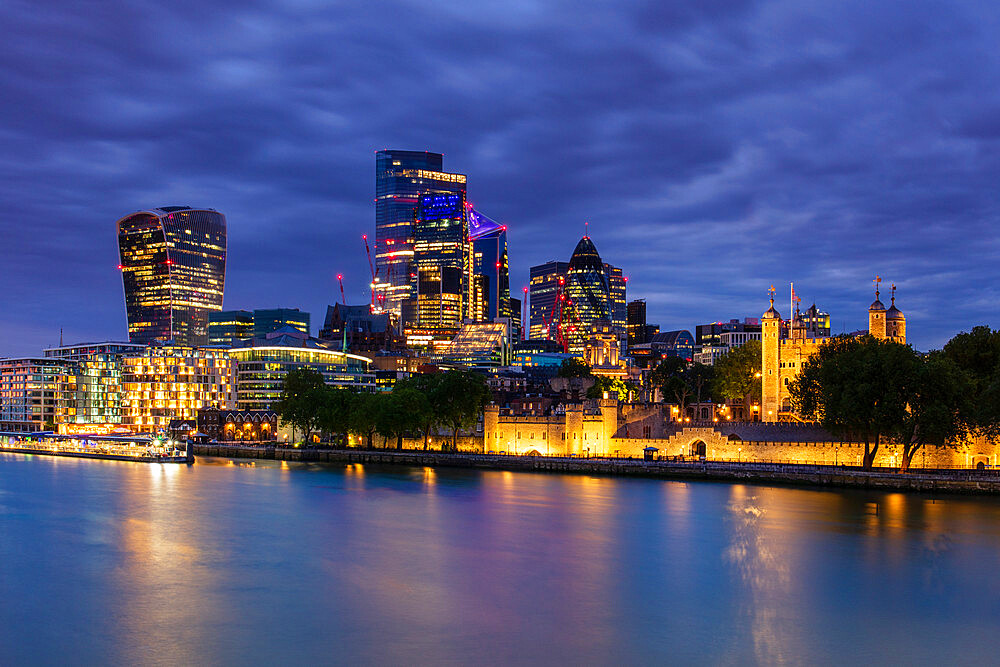 City of London skyscrapers including Walkie Talkie building and Tower of London at dusk, London, England, United Kingdom, Europe