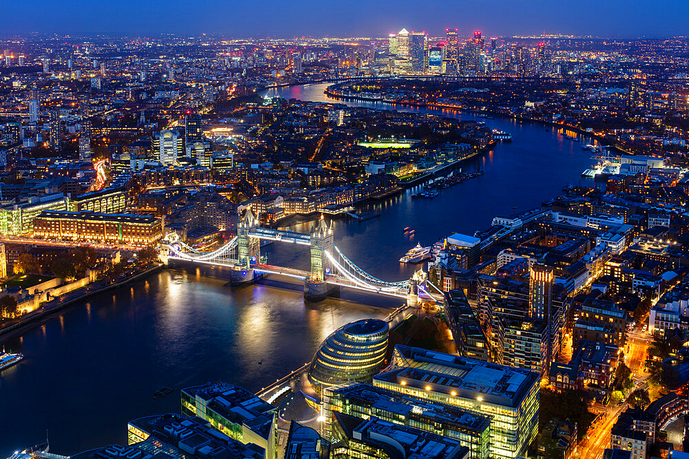 River Thames, Tower Bridge and Canary Wharf from above at dusk, London, England, United Kingdom, Europe