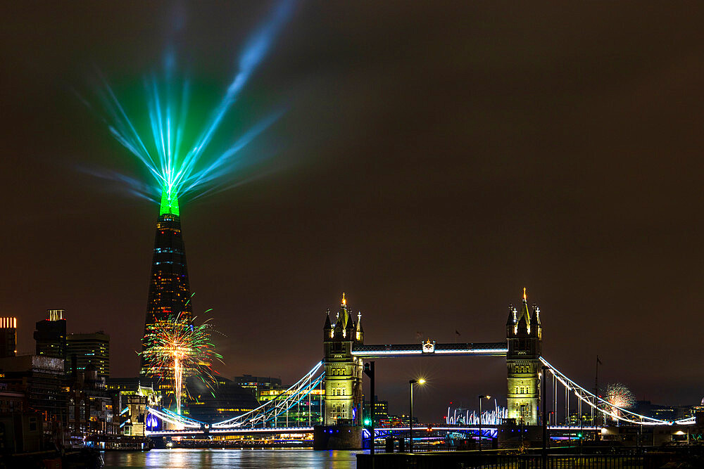 New Year 2022 firework and light display by The Shard and Tower Bridge, London, England, United Kingdom, Europe