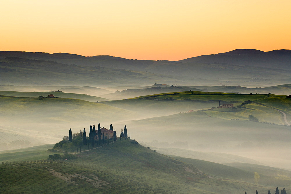 Podere Belvedere and misty hills at sunrise, Val d'Orcia, San Quirico d'Orcia, UNESCO World Heritage Site, Tuscany, Italy, Europe