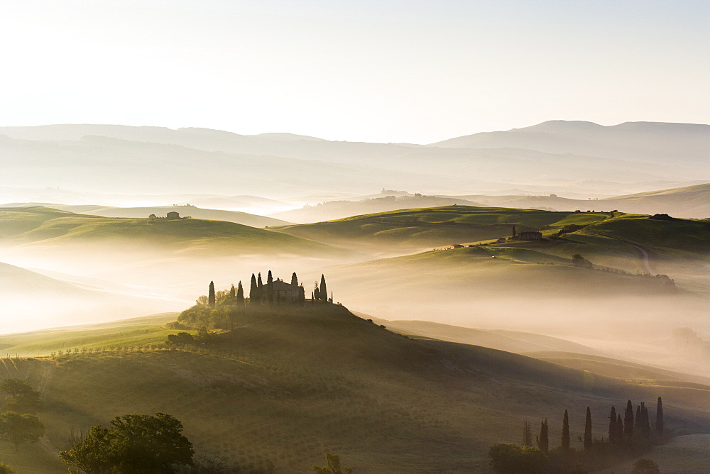 Podere Belvedere and misty hills at sunrise, Val d'Orcia, San Quirico d'Orcia, UNESCO World Heritage Site, Tuscany, Italy, Europe