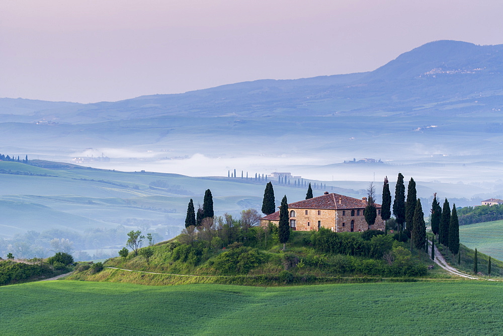 Podere Belvedere and misty hills at sunrise, Val d'Orcia, San Quirico d'Orcia, UNESCO World Heritage Site, Tuscany, Italy, Europe